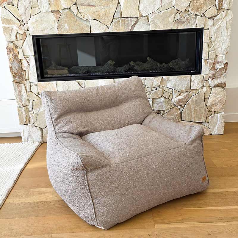 Taupe Bouclé Serena Armchair Bean Bag by Mooi Living positioned in a contemporary interior.