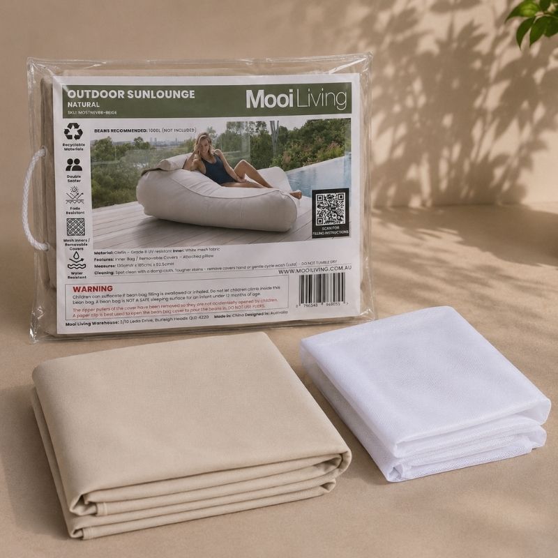 Folded Outdoor Sunlounger bean bag cover in Natural and inner bag in a Mooi Living packaging.