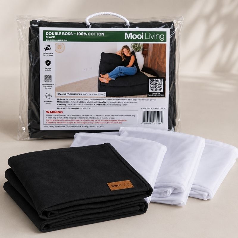 Folded Cotton Boss Bean Bag Chair cover in Black and inner bags in a Mooi Living packaging.