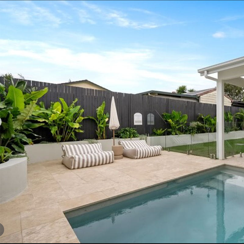 Taupe Stripe Double Seater Chill UV Loungers outdoor Bean Bag by Mooi Living. poolside with umbrella and greenery, customer photo by @house.of.arco.