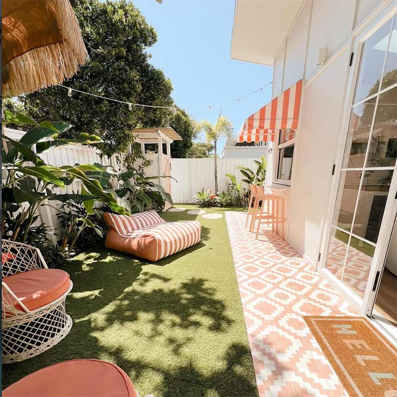 Blush Stripe Chill UV Double Seater Lounger outdoor Bean Bag by Mooi Living. styled in a backyard with coordinating blush décor, customer photo by @thecabana_casuarina.