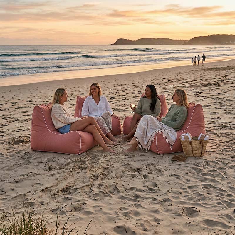Lifestyle Image: Blush Solid Bora Bora Bean Bag chairs outdoor bean bag by Mooi Living on the bean with 4 girls sitting on them in total comfort. Take outdoor comfort everywhere with you.