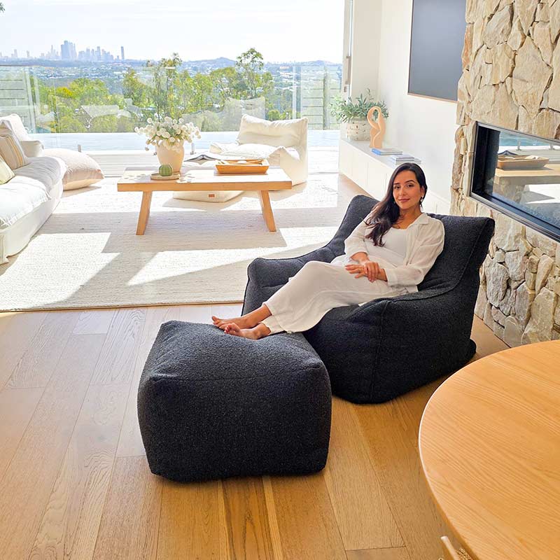 Mooi Living Black Serena bouclé indoor bean bag chair paired with matching ottoman indoor bean bag by Mooi Living in a modern setting.