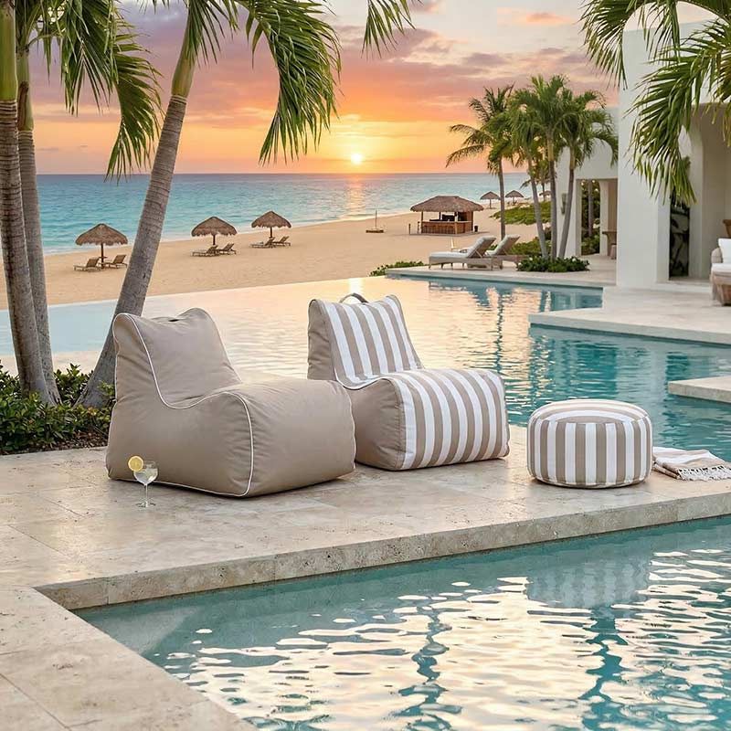 Lifestyle Image - a Taupe Solid and Taupe Stripe Bora Bora  outdoor bean bag by Mooi Living outdoor bean bag chair located at a tropical resort.