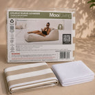 Folded Cojelo suave lounger bean bag cover in Taupe and white stripe  and inner bag in a Mooi Living packaging.