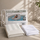 Folded Lana lounger pool float bean bag cover in Oyster black and white stripe  and inner bag in a Mooi Living packaging.