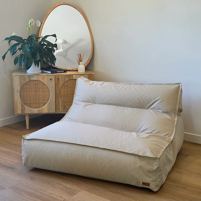 Natural Double Boss double seater bean bag chair by Mooi Living positioned in a modern living room.