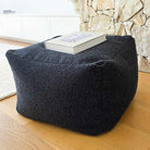 Mooi Living Serena ottoman indoor bean bag by Mooi Living in Black featuring bouclé upholstery.