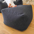 Serena Ottoman in Black bouclé by Mooi Living.