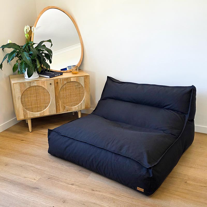 Black Double Boss large two person bean bag by Mooi Living styled in a modern indoor space.