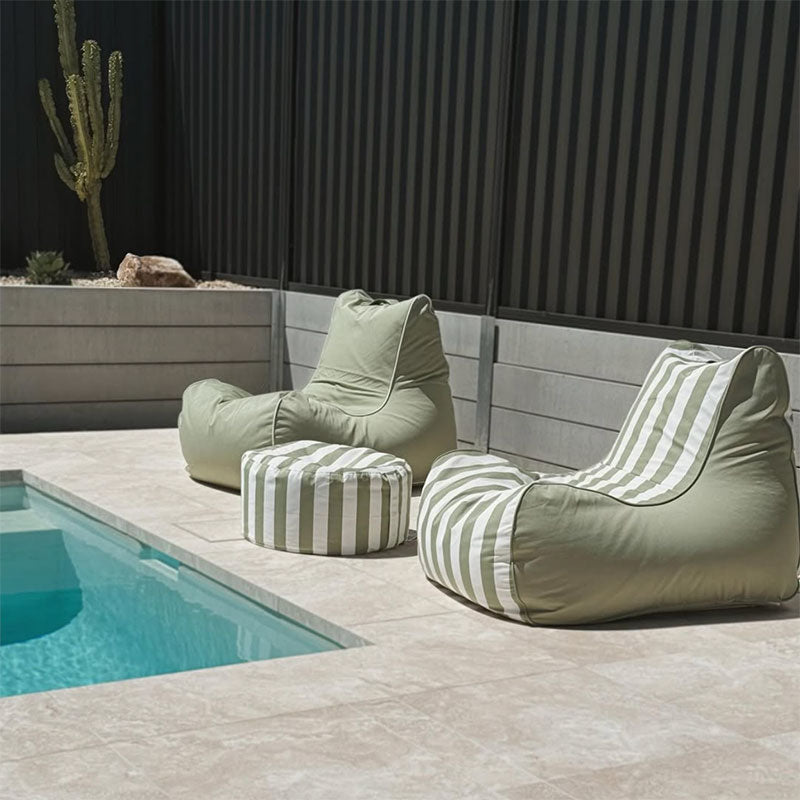 Green Stripe Bora Bora Bean Bag Chair and Sage Green Solid Bora Bean Bag with Green Stripe Outdoor Ottoman outdoor bean bag by Mooi Living in a poolside setting, customer photo by @casa_griffin