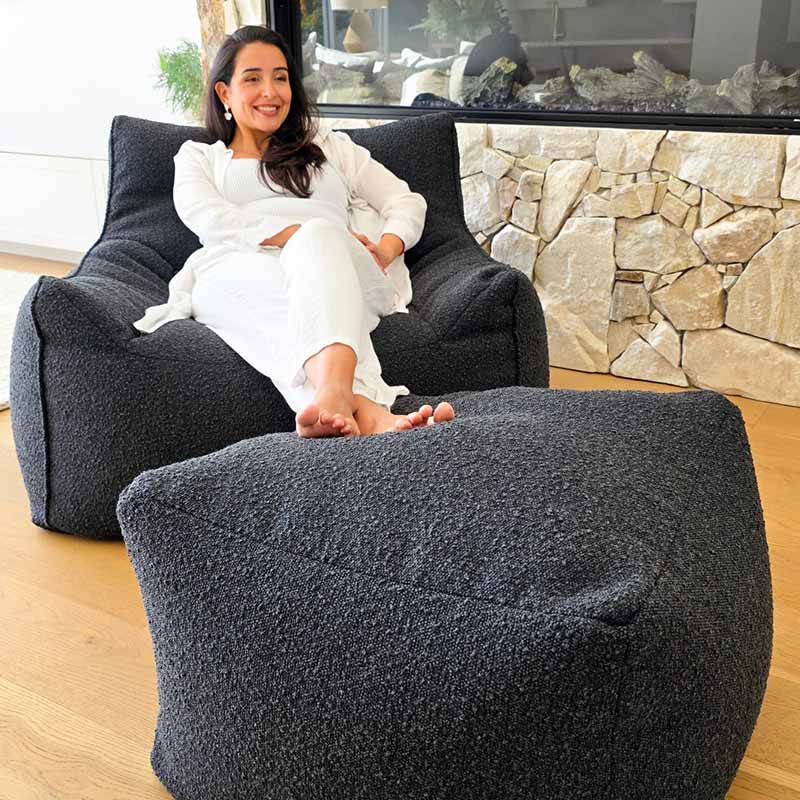 Mooi Living Serena Armchair indoor bean bag by Mooi Living in textured black bouclé paired with matching ottoman.